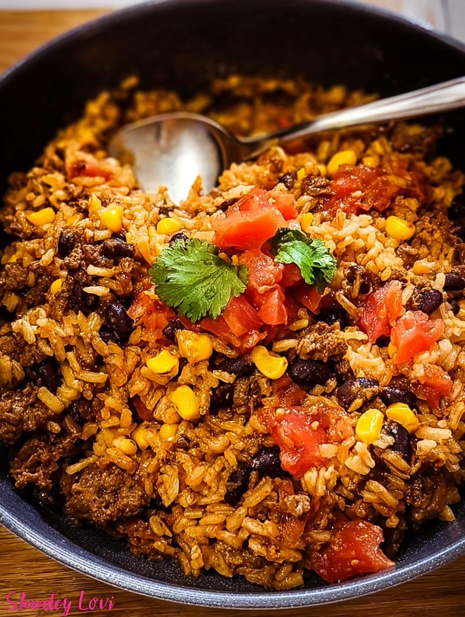Mexican Beef Rice Skillet: My 30-Minute Amazing Meal 5 Delicious Mexican Beef Rice Skillet topped with melted cheese, fresh cilantro, and cherry tomatoes